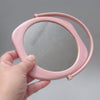 Petit miroir en plastique rose Annees 80 Petit miroir en plastique rose Annees 80