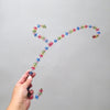 Cintre bijoux à perles multicolores